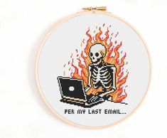 a cross stitch skeleton sitting in front of a laptop on fire with the words peer my last email