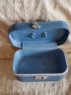 Rare Find, Rustic Powder Blue, Airplane No Name, Train Case or Makeup Suitcase, Mid Century Travel Box This is such a fun find. It is in good shape. It does have some wear and tear from age. (Please see pictures) Makes a great decoration, still very functional or would look good at a wedding reception. Perfect for a photo prop. This measures 7.40 inches tall, 7 inches deep and 12 inches long. Check out our shop for monthly specials. We have a variety of items for every taste. Combine several of Portable Blue Travel Cases, Blue Rectangular Travel Cases, Blue Rectangular School Case, Blue Rectangular Cases For School, Blue Portable Rectangular Case, Portable Blue Cases For Storage, Makeup Suitcase, Blue Airplane, Name Train