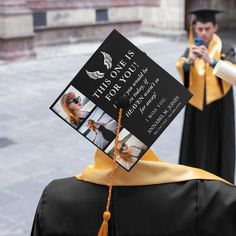 a graduate's cap and gown is held up in the air by another student