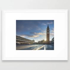 a large clock tower towering over a city