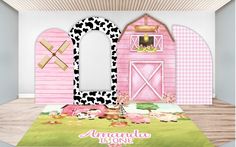 a room with a pink barn and cow rug on the floor next to a mirror