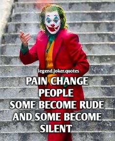 a man dressed as the joker standing in front of stairs with his hands up and saying,'pain change people some become rude