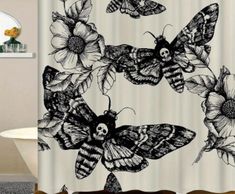 a shower curtain with butterflies and flowers in black and white colors on the outside of it