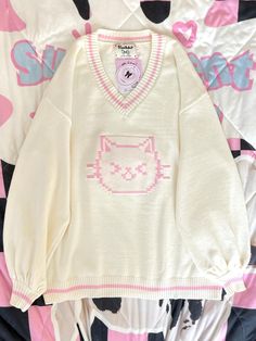 This sweater features a charming V-neck design adorned with delightful kitty patterns, making it irresistibly cute. The fabric is incredibly soft and cozy, ensuring a comfortable wear.  Please note that the price includes only the sweater.   	 		 			Size 			S 			M 			L 		 		 			Length 			62 			68 			72 		 		 			Bust 			120 			124 			128 		 		 			Sleeve Length 			49 			50 			51 Kawaii Sweater Dress, Cute Sweaters Aesthetic, Cozy Clothes Aesthetic, Cute Core Clothes, Kirby Sweater, Pokemon Sweater, Cute Kawaii Clothes, Pastel Clothes, Cute Kawaii Outfits