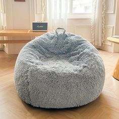 This plush and cozy fluffy bean bag chair cover is the perfect place to store all your favorite stuffed animals. Made of ultra soft faux fur, this fluffy storage bag feels luxurious to the touch. At over 3 feet wide, it's spacious enough to hold dozens of plush toys while looking cute and decorative in any room. The soft shaggy fabric is easy to clean for quick messes. And with no filler included, you can choose to keep it lightweight or add your own beans or pellets for extra slouch. Snuggle up Big Bean Bag, Big Bean Bag Chairs, Bean Bag Seats, Big Comfy Chair, Fur Bean Bag, Large Bean Bag Chairs, Chair Covers Slipcover, Bean Bag Bed, Large Bean Bags