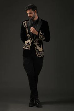 Black silk lined tuxedo with notched lapel, animal and floral resham, zari embroidery.
Component: 1
Pattern: Embroidered
Type Of Work: Resham, Zari
Neckline: Notched Lapel
Sleeve Type: Full
Fabric: Silk Velvet, Lining: Silk
Color: Black
Other Details: 
Note: Pant and inner shirt worn by the model is not for sale
Occasion: Cocktail,Reception - Aza Fashions Tuxedo For Wedding, Embroidered Tuxedo, Black Blazer Men, Zari Embroidery, Rohit Bal, Cocktail Outfit, Bespoke Fashion, Tuxedo Blazer, Cocktail Reception