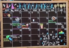 a chalkboard with the calendar written on it in front of some baskets and other items