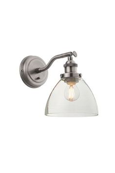 a wall light with a clear glass shade on the front and back of it's arm