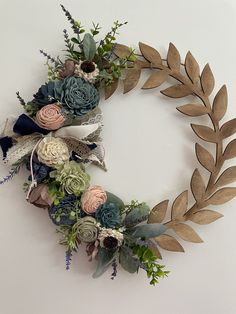 a wreath made out of flowers and leaves