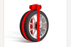 a motorcycle wheel with a red ribbon tied around the spokes on it's side