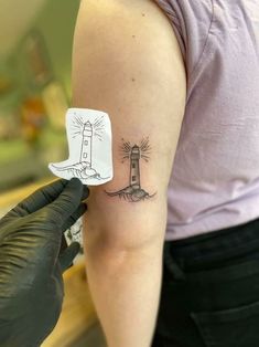 Unique & Cute Travel Tattoo Ideas For Women Lighthouse Ankle Tattoo, Simple Light House Tattoo, Light House Tattoo Minimalist, Fine Line Lighthouse Tattoo, Lighthouse Tattoo Simple, Simple Lighthouse Tattoo, Minimalist Lighthouse Tattoo