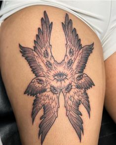 a woman's thigh with two birds on it