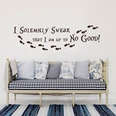 a couch sitting in front of a wall that says i solemnly swear that i am up to good