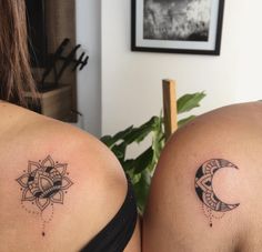 two women with matching tattoos on their backs