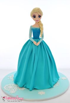 a cake that has a doll in it's dress on top of a plate