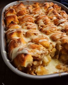 a casserole dish filled with meat and cheese