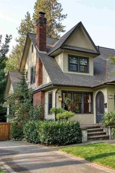 a large house with lots of windows in the front yard