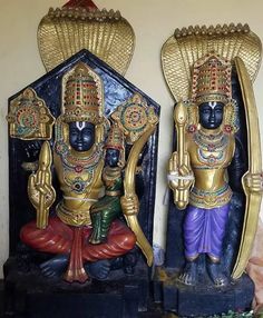 two statues of hindu deities are on display