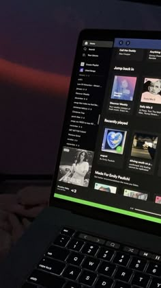 an open laptop computer sitting on top of a table