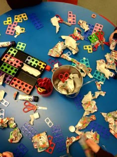 children are playing with toys on the table