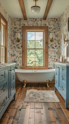 a bathroom with blue cabinets and a white bathtub in the middle of the room