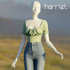 the mannequin is wearing jeans and a green shirt