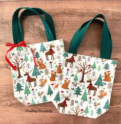 two bags with deer and trees on them