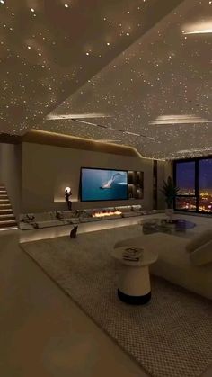 a large living room with white furniture and stars on the ceiling is lit by lights