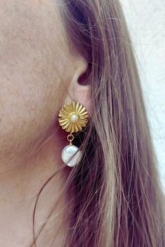 These beautiful floral earrings are handcrafted with a 14k gold plated freshwater pearl flower studs and themed with a freshwater pearl drop charm. Beautiful for a bride to be on their special day, for bridesmaids or simply just a special occasion. Please note, every freshwater pearl has a different size. ♥ Packaging Each item is individually packed in a gift box. ♥ Shipping Shipping is free within the UK by Royal Mail 2nd Class (2-3 business days). All international delivery is Royal Mail Inter Handmade Baroque Pearl Drop Earrings, Delicate Handmade Baroque Pearl Earrings, Handmade Dainty Gold-plated Pearl Earrings, Flower Shaped Pearl Charm Jewelry, Floral Pearl Charm Jewelry, Elegant Pearl Jewelry With Flower Charm, Pearl Flower-shaped Jewelry For Anniversary, Dainty Flower Shaped Pearl Charm Jewelry, Delicate Pearl Jewelry With Flower Charm