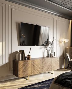 a large flat screen tv mounted to the side of a wooden cabinet in a living room