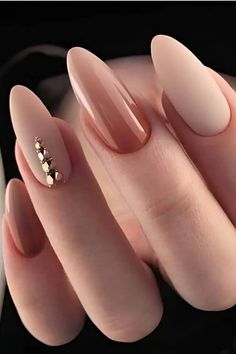 a manicure with some gold decorations on it