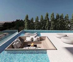 an outdoor lounge area next to a swimming pool