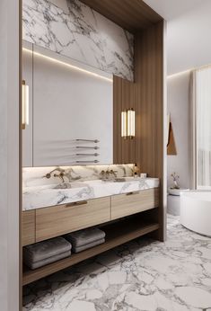 a bathroom with marble counter tops and wooden cabinetry, along with a bathtub