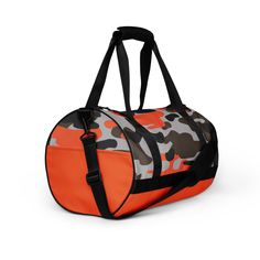 an orange duffel bag with camouflage print