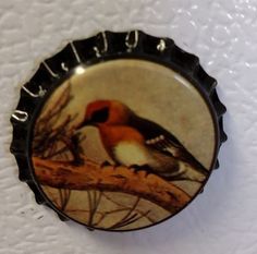 there is a bottle cap with a bird on it and the word's name