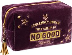 a purple cosmetic bag with gold lettering and stars on the side that says, i solemnly swear that i am up to no good