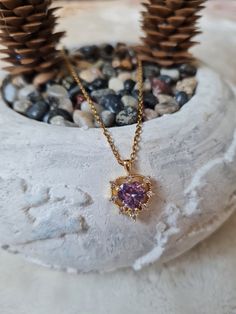 Elevate your style with this stunning necklace featuring a vibrant purple zircon stone. Handcrafted with care, this unique piece adds a touch of elegance to any outfit. The rich, deep hue of the zircon stone is complemented by a delicate chain, creating a perfect blend of sophistication and charm. Treat yourself or surprise a loved one with this exquisite purple zircon necklace. Dazzling Cubic Zirconia Birthstone Necklaces, Dazzling Cubic Zirconia Birthstone Necklace, Purple Heart Pendant Necklace As Gift, Dazzling Necklaces With Sparkling Stones For Gifts, Cubic Zirconia Heart Cut Birthstone Necklaces, Heart Cut Birthstone Necklace In Cubic Zirconia, Purple Cubic Zirconia Necklaces For Anniversary, Cubic Zirconia Round Pendant Crystal Necklace As Gift, Purple Amethyst Heart Pendant Necklace