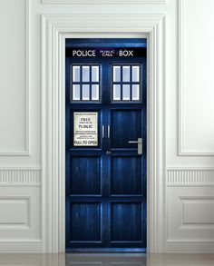 a blue police box door in a white room