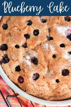 a blueberry cobble cake sitting on top of a cooling rack