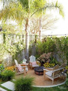 an outdoor patio with chairs and trees in the background