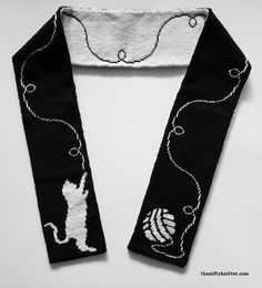 a black and white scarf with a dog on it