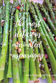 asparagus on a white plate with the words, the most delicious married appetizers