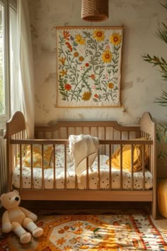 a baby crib with a teddy bear in the corner and a rug on the floor