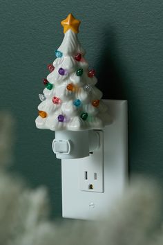 a white christmas tree light switch cover