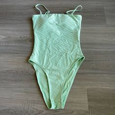 Whether You Wear It As A Strapless Bodysuit Or For A Dip In The Ocean, This Versatile Swimsuit Always Looks Great. Add A Wraparound Maxi Skirt For Pool-Party Chic Or Wear It With Straps For A Sunset Swim. Squareneck Detachable Straps Pull-On Style Padded Cups High-Cut Leg Lined Nylon/Elastane Machine Wash Green Lined Swimwear For Spring, Chic Green Swimwear For Spring, Chic Green Spring Swimwear, Sunset Swim, Strapless Bodysuit, In The Ocean, High Cut, Pool Party, The Ocean