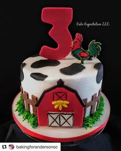 a birthday cake with a farm scene and number one on it's top tier