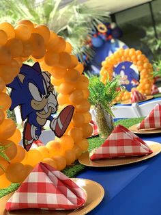 a sonic the hedgehog themed birthday party with balloons and napkins on a table