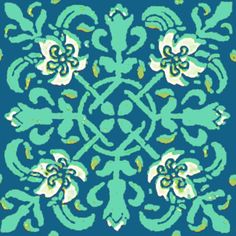 a blue and green pattern with white flowers on the center, in an ornate design