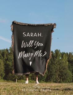 a black banner with white writing on it that says, sarah will you marry me?