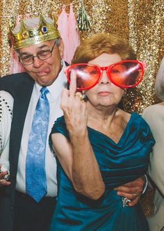 an older man and woman posing for a photo with red glasses on their faces, the caption reads full of attitude & fock you's fill the day i die